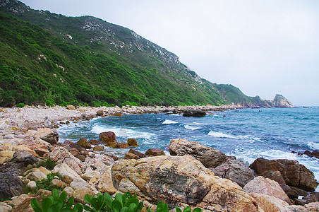 中国的海边有巨大的岩石海浪色调海湾海洋旅行天空海水风景垂直度天气图片