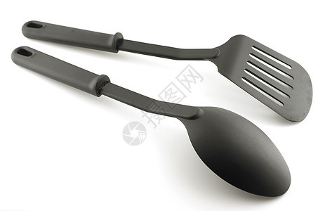 白色上黑色塑料厨房用具工具厨具厨师美食食物晚餐火炉油炸勺子服务图片