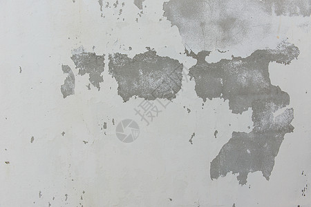 白漆水泥墙上的碎裂板航班蓝色帆布航空石头天空材料土地地面商业图片