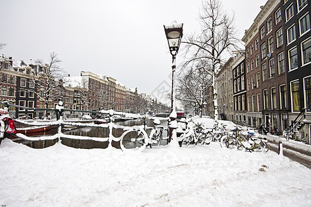 荷兰的Snowy 阿姆斯特丹运输首都中心城市建筑建筑学房子风光特丹自行车图片