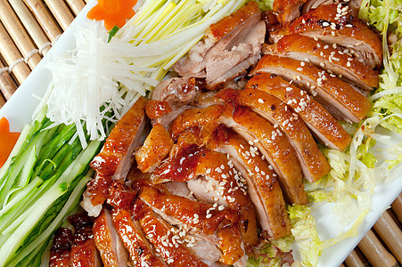 烤鸭 中式烹饪红色鸭子炙烤主菜香料菜肴美食家禽洋葱图片