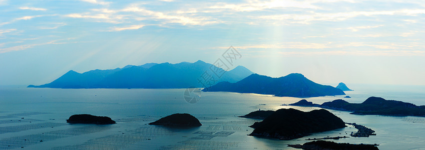 海洋景观旅行海景风景辉光射线光束太阳蓝色晴天山脉图片