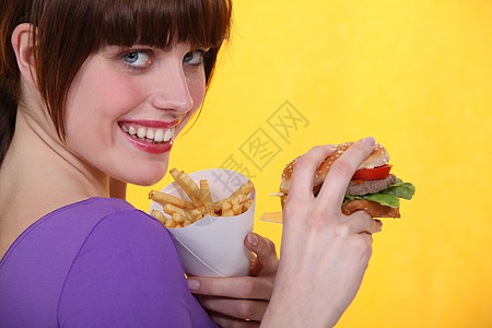 妇女吃垃圾食品快乐馅饼营养女孩女性饮食包子饥饿学生面包图片