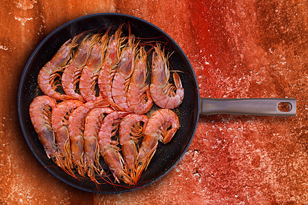 圆锅烤虾海鲜甲壳平底锅橙子饮食市场动物海洋烹饪桌子贝类图片