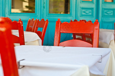 希腊酒馆桌子岛屿建筑学石膏编织旅行花朵餐厅街道椅子图片