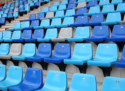 体育场的蓝色座位场地会场塑料椅子看台运动空白长椅民众观众背景图片