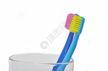 玻璃杯中多彩的牙刷刷子紫色牙医白色化妆品卫生牙科塑料活力玻璃图片