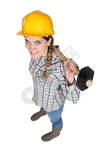 女性体力劳动者工具男人金属木匠锤子冲击核桃木建造木工破坏图片