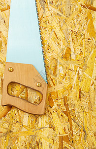 胶合板上的手掌工具施工硬木工作手锯木匠木工安全乐器测量图片
