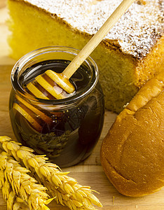 健康的蜂蜜罐加面包制品图片