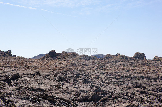 兰萨罗特的某个地方海滩旅行阳光荒野天空岩石爬坡目的地时间沙漠图片