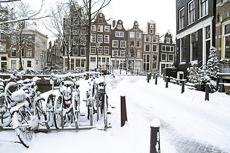荷兰的Snowy 阿姆斯特丹建筑学城市首都房子运输自行车特丹建筑历史图片