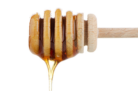 木制干洗机上的蜂蜜甜点产品金子花蜜治愈早餐用具液体营养玻璃图片