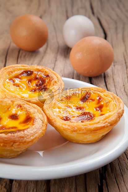 葡式蛋挞圆圈食物黄油馅饼盘子甜点小吃早餐包子糕点图片