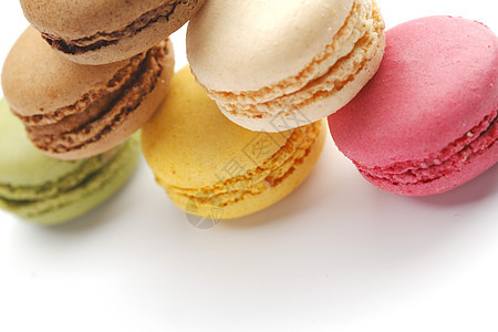 色彩多彩的马卡龙食物美食糕点粉色白色饼干蛋糕糖果奶油甜点背景图片