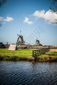 荷兰风车翅膀木头能源建筑蓝色瓷砖天空图片