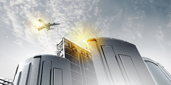 天空中的平地摩天大楼办公室建筑学客机蓝色街道飞机公司地标玻璃图片
