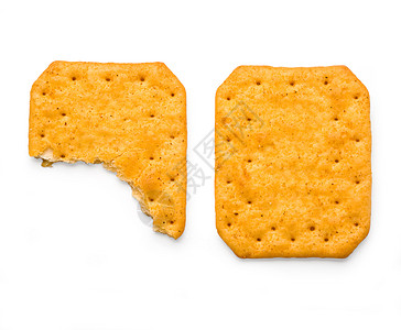 长方形饼干孤立在白色上的盐碱苏打饼干食物长方形正方形美食饮食小吃小麦宏观早餐黄色背景