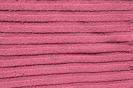 编织结构粉色手工纤维条纹毛衣织物背景图片