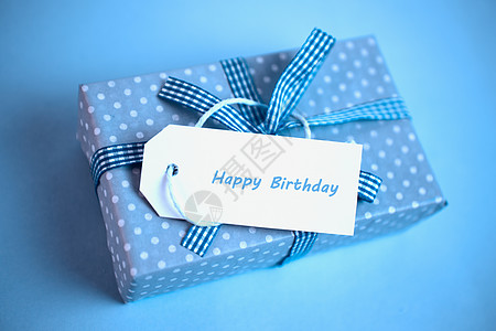 生日快乐礼物蓝色的漂亮礼物 生日贺卡满蓝色背景背景