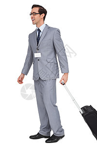带着手提箱走着微笑的商务人士商业名片领带人士旅行套装衬衫行李游客公司图片