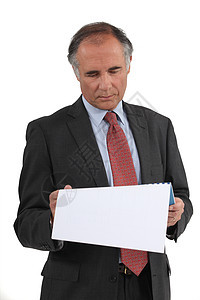 商界人士阅读文件银行家推销员职业男人商务代理人贷款财产专注管理人员图片