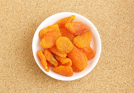 带牙签的干杏仁木板干果脱水水果桃干饮食软木橙子甜点背景图片