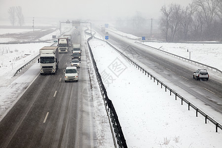 雪地高速公路旅行卡车货车驾驶路线货运国家速度暴风雪商业图片