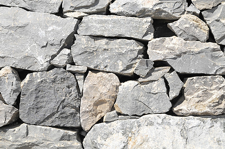 灰岩古城墙花岗岩宏观黑色鹅卵石水泥灰色建筑学材料纹理矿物图片