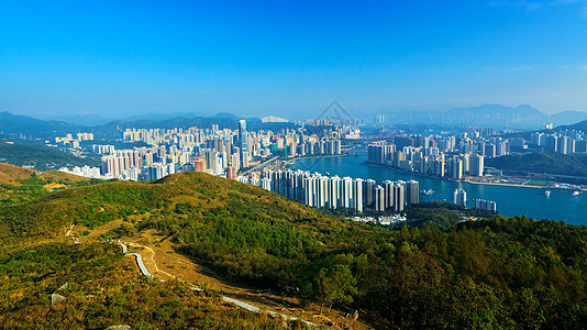 中湾市中心九龙香港的景象摩天大楼辉光紫色交通建筑物街道旅行日落地平线天际图片