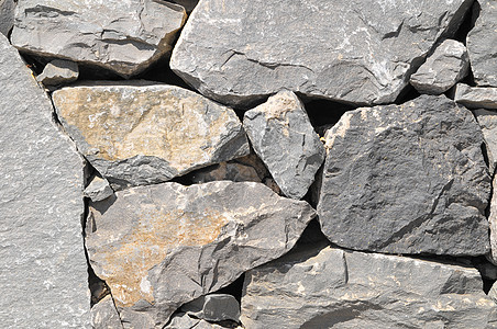 灰岩古城墙黑色风化石头建筑学材料纹理灰色矿物大理石花岗岩图片