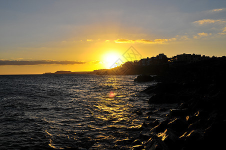 大西洋上空的日落日出天空城市海滩海洋橙子海岸线海岸风景村庄图片