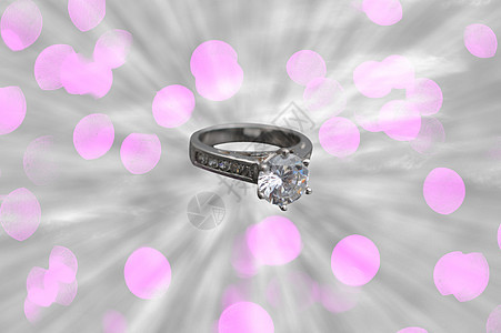 结婚戒指口音婚姻圆形珠宝单人宝石太阳光线太阳钻石订婚背景图片