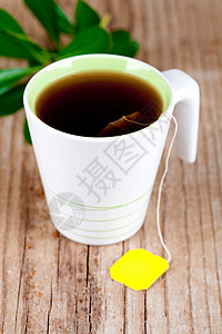 茶杯茶乡村茶包棕色脆皮甜点面包糕点黄色液体白色图片