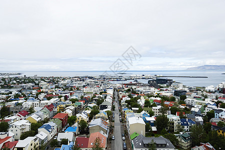 冰岛雷克雅未克市房子海洋天空街道中心蓝色建筑学场景旅行远景图片
