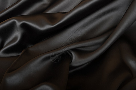 丝绸背景黑色材料涟漪衣服布料纺织品奢华波浪状窗帘图片