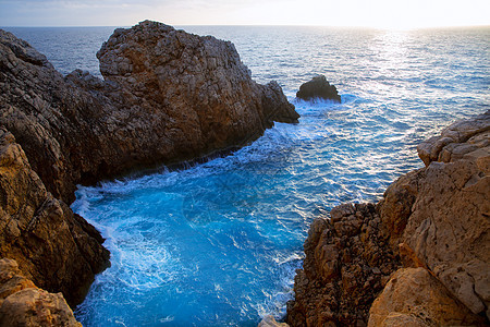 巴利阿里群岛的日落天空海岸石头海景旅行海滩支撑海洋悬崖蓝色图片