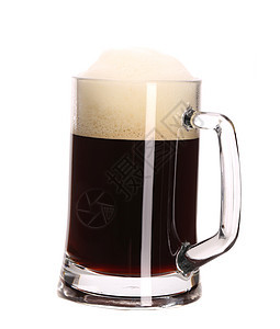 高大的棕色啤酒杯 与泡沫庆典黄色酒精琥珀色流动白色酿造啤酒饮料金子图片