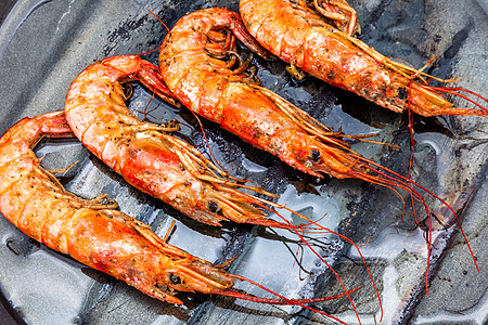 烧烤虾虾烤动物海鲜饮食红色沙拉贝类甲壳油炸烹饪橙子背景