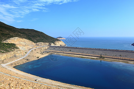 香港地公园的海岛水库公园岩石石头折叠六边形蓝色阳光火山国家小路图片