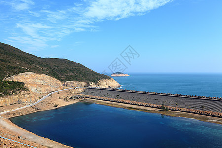 香港地公园的海岛水库折叠天空柱子阳光石头蓝色火山国家小路太阳图片