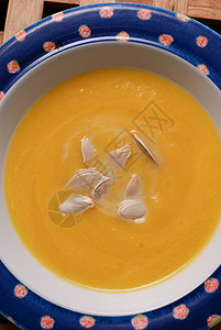 南南瓜汤橙子盘子食物蓝色黄色种子图片