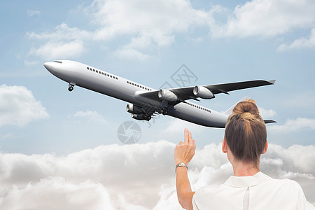 商业女商务人士触摸某些东西的复合形象假期飞机太阳多云绘图旅游金发女士航空计算机图片