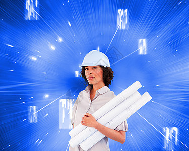 自信女性持有施工计划的综合形象火花棕色线条头盔建筑师快乐蓝图安全帽微笑计算机图片