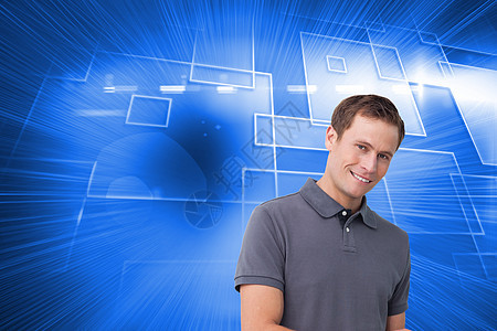 微笑的年轻男子用平板电脑综合图像牛仔裤穿越计算机男性触摸屏技术联锁绘图药片快乐图片