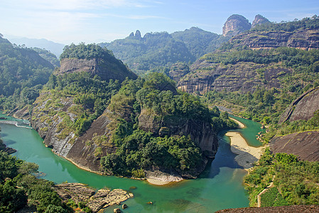 中国福建省武伊山峡谷 中国旅游山沟林地岩石木头吸引力溪流蓝色太阳季节图片