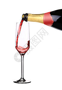 红香槟倒在空玻璃杯里图片