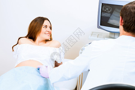 接受医生诊治的怀孕妇女诊所顾问成人生育力女性检查女士婴儿考试卫生图片