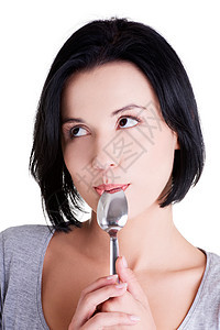 女人嘴里有勺子饮食成人微笑女性女孩工具乐趣食欲快乐黑发图片