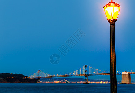 加利福尼亚州旧金山码头7日落海洋反射市中心蓝色假期建筑学建筑物摩天大楼旅行天空图片